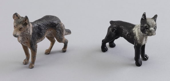 TWO GERMAN COLD-PAINTED BRONZE DOGS Early 20th Century Lengths 3" and 3.75".