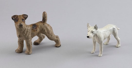 TWO COLD-PAINTED BRONZE DOGS Early 20th Century Heights 2.5" and 3". Lengths 3" and 4".