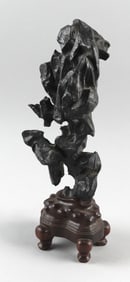 CHINESE BLACK LINGBI SCHOLAR'S STONE Height 12". With a carved wooden stand, height 4".