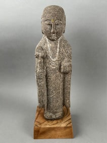 CHINESE ARCHAIC CARVED STONE FIGURE OF A SCHOLAR Height 12". Wood base 4" x 4".