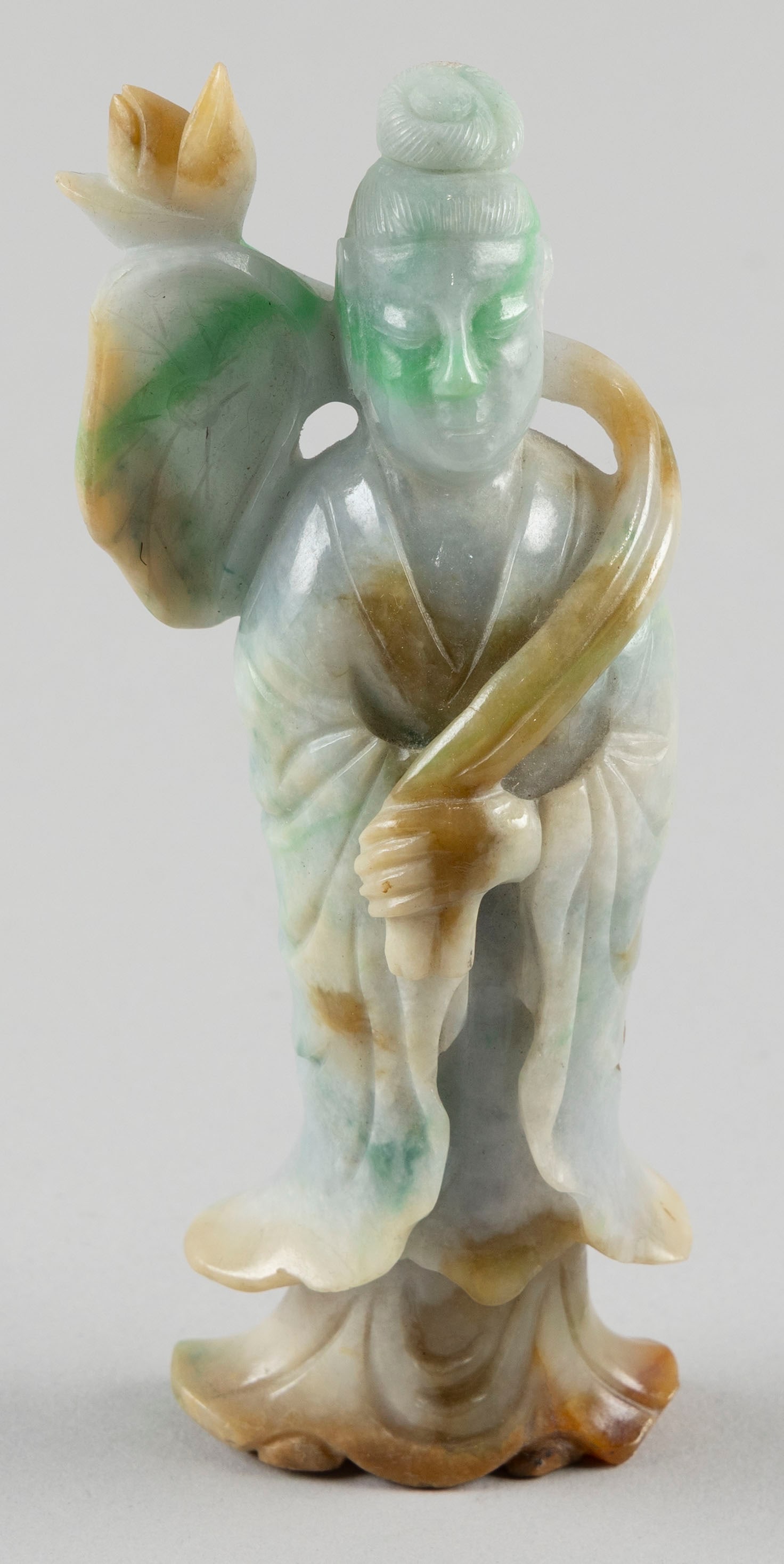 CHINESE CARVED CELADON GREEN AND LAVENDER JADE FIGURE OF GUANYIN 19th Century Height 6".: CHINESE CARVED CELADON GREEN AND LAVENDER JADE FIGURE OF GUANYIN19th CenturyHolding a lotus staff. Some russet skin tone highlights and calcification at base.Height 6".