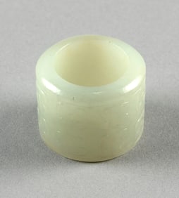 CHINESE CARVED WHITE JADE ARCHER'S RING 19th Century Height 1". Diameter 1".