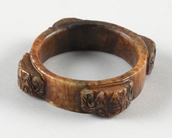 CHINESE CARVED MOTTLED BROWN JADE CONG/BANGLE BRACELET Length across bats 4". Interior diameter
