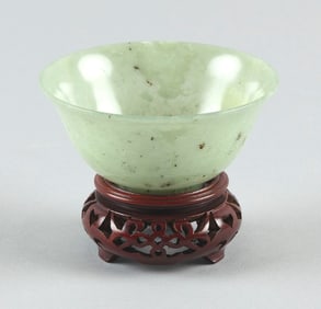 CHINESE TRANSLUCENT CELADON JADE BOWL 19th Century Height 2". Diameter 4". With a carved wooden