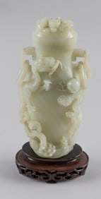 CHINESE CARVED WHITE JADE COVERED VASE 19th Century Height 9". With a carved wooden stand and a