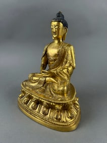 NEPALESE GILT BRONZE BUDDHA Early 20th Century Height 7.5". Length 6".