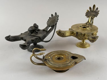 THREE BRASS AND BRONZE ALADDIN-STYLE LAMPS Late 19th/Early 20th Century Heights from 1.75" to 6".