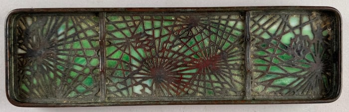TIFFANY STUDIOS "PINE NEEDLE" BRONZE AND GLASS PEN TRAY New York, Early 20th Century Length 9.75".