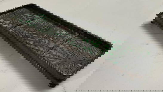 TIFFANY STUDIOS "PINE NEEDLE" BRONZE AND GLASS PEN TRAY New York, Early 20th Century Length 9.75".: TIFFANY STUDIOS "PINE NEEDLE" BRONZE AND GLASS PEN TRAYNew York, Early 20th CenturyModel #1004. Marked.Length 9.75". Width 2.875". Height .75".
