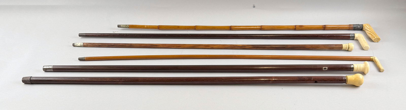COLLECTION OF SIX CANES Late 19th/Early 20th Century Lengths from 33.75" to 36.25". (1 of 9)