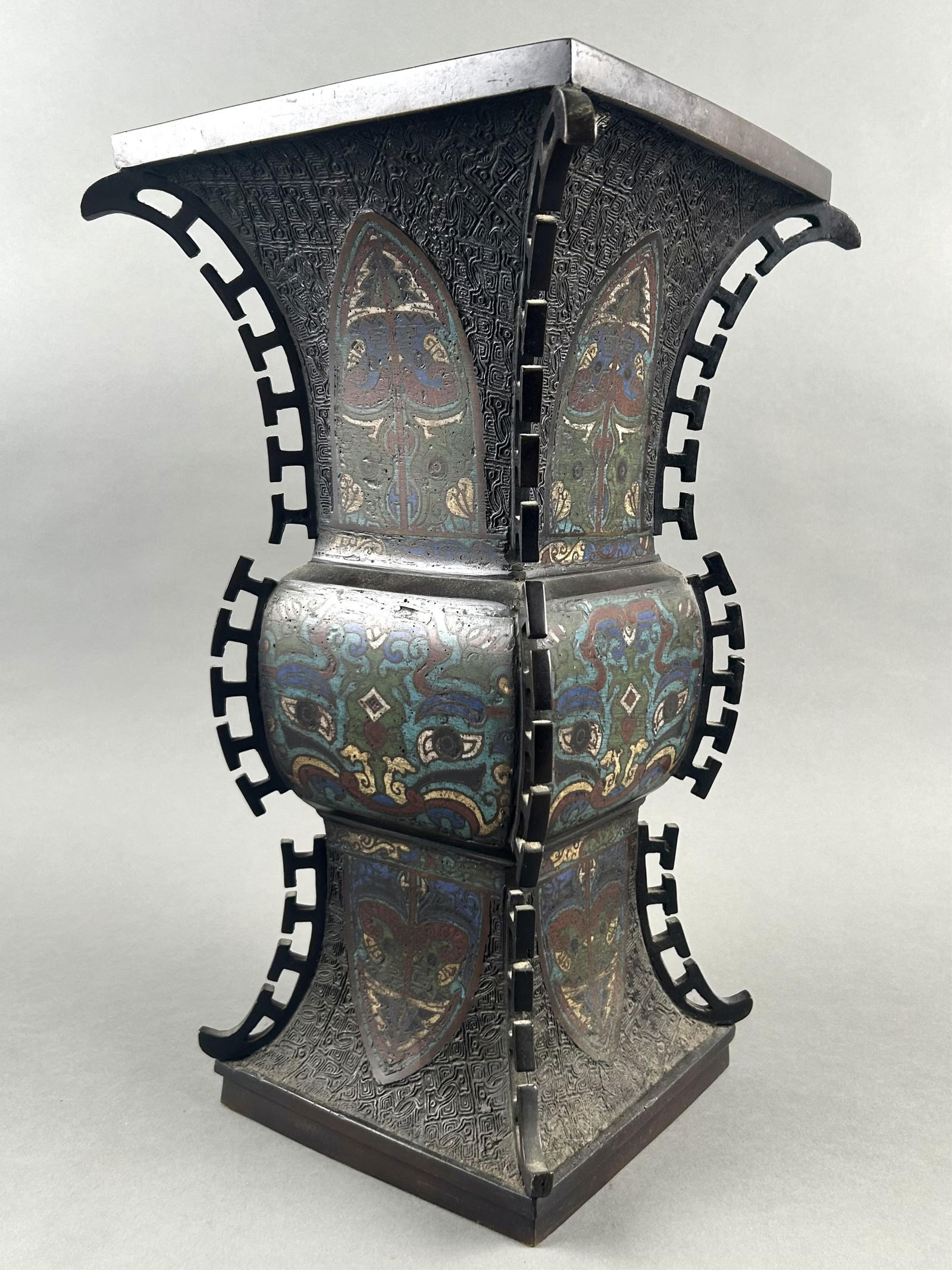 CHINESE CLOISONNE AND BRONZE GU VASE 19th Century Height 16".: CHINESE CLOISONNE AND BRONZE GU VASE19th CenturyTaotie mask design on each panel. Flanged edges. Six-character mark on base.Height 16".
