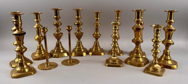 SEVEN PAIRS OF BRASS CANDLESTICKS 19th Century Heights from 7.25" to 10".