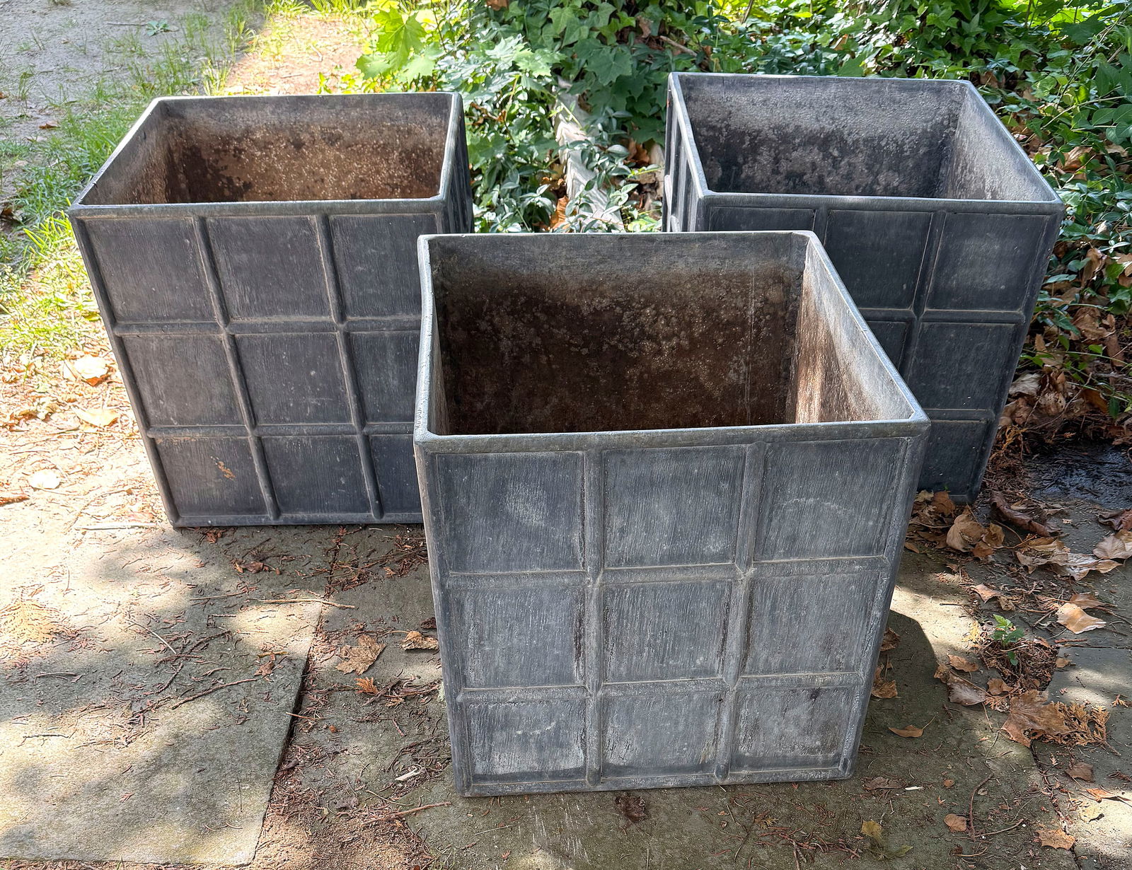 THREE LARGE CANADIAN EDWARDIAN-STYLE LEAD PLANTERS Heights 18". Widths 18". Depths 18". (1 of 2)