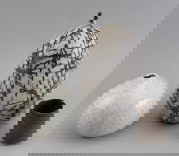 THREE STUDIO ART POTTERY VESSELS 20th/21st Century: THREE STUDIO ART POTTERY VESSELS20th/21st Century1) Seed-form vase by Ron Dean with black striations on white. Signed and numbered 184. Height 11.5".2) Ovoid crackleware vase by Amy Sarner. Signed and