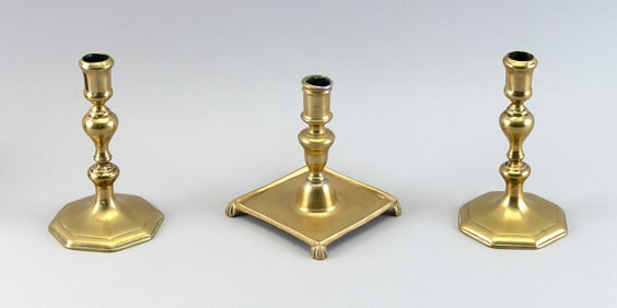 THREE BRASS CANDLESTICKS 18th/19th Century Heights 6" and 7".