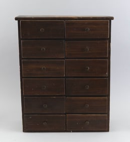 TWELVE-DRAWER CHEST WITH COLLECTION OF BUTTONS Late 19th and 20th Century Chest height 18". Width