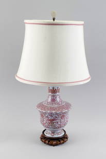 CHINESE FAMILLE ROSE PORCELAIN VASE 20th Century Total height 26.25".: CHINESE FAMILLE ROSE PORCELAIN VASE20th CenturyPhoenix and lotus decoration with an unusual stippled lappet design at shoulder. Mounted as a table lamp and affixed to a carved wooden base. Carved serp