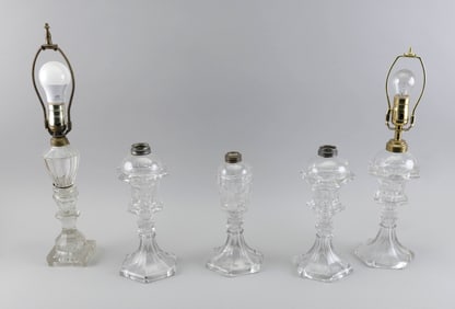 FIVE PRESSED CLEAR GLASS LAMPS 19th Century Heights to collars from 10" to 11.5".