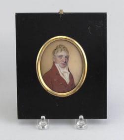 PORTRAIT MINIATURE OF A MAN IN A RED JACKET Early 19th Century Watercolor on ivory, 2.75" x 2.25".