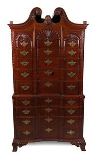 CUSTOM-MADE CHIPPENDALE-STYLE MAHOGANY BLOCK-FRONT CHEST-ON-CHEST 20th Century Height 83.5". Width: CUSTOM-MADE CHIPPENDALE-STYLE MAHOGANY BLOCK-FRONT CHEST-ON-CHEST20th CenturyBonnet top with dentil molding and flaming urn finials. Upper case with rope-turned quarter columns and three shell-carved