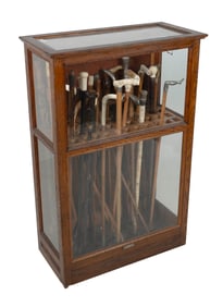 A.N. RUSSELL & SONS CANE DISPLAY CASE AND A COLLECTION OF CANES Ilion, New York, 19th/20th Century