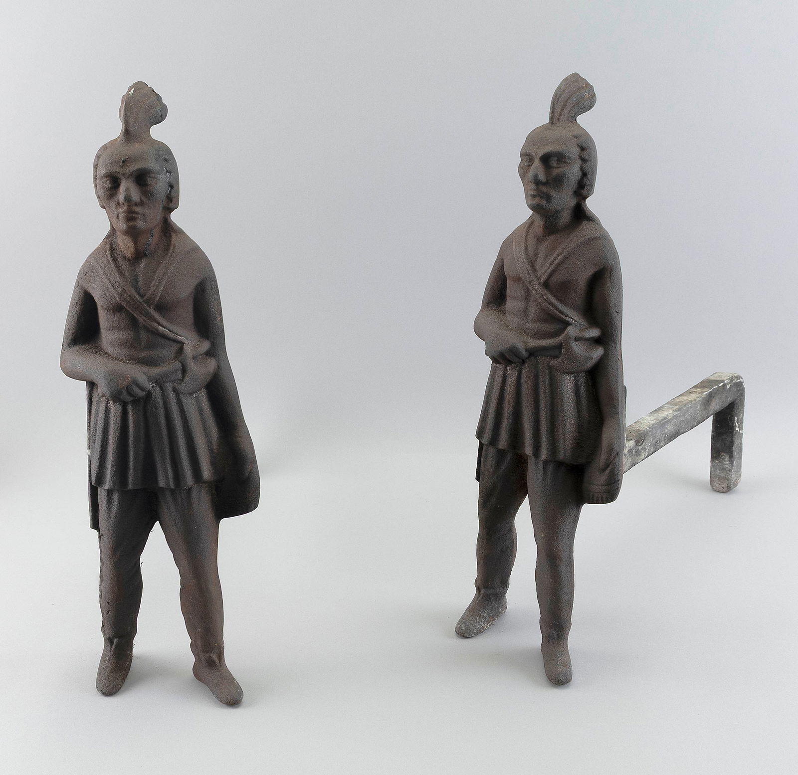 PAIR OF CAST IRON FIGURAL ANDIRONS Early 20th Century Heights 20.5".: PAIR OF CAST IRON FIGURAL ANDIRONSEarly 20th CenturyFormed as Native American warriors.Heights 20.5".