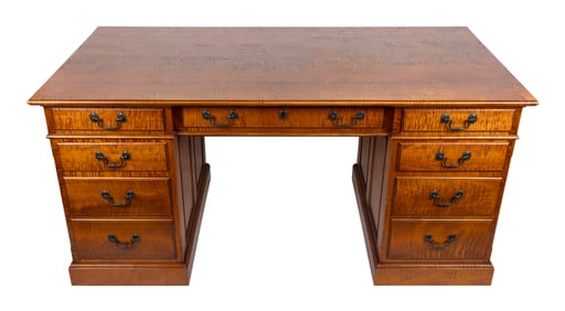 ELDRED WHEELER TIGER MAPLE DESK Massachusetts, 20th Century Height 30.5". Width 64". Depth 33.25".