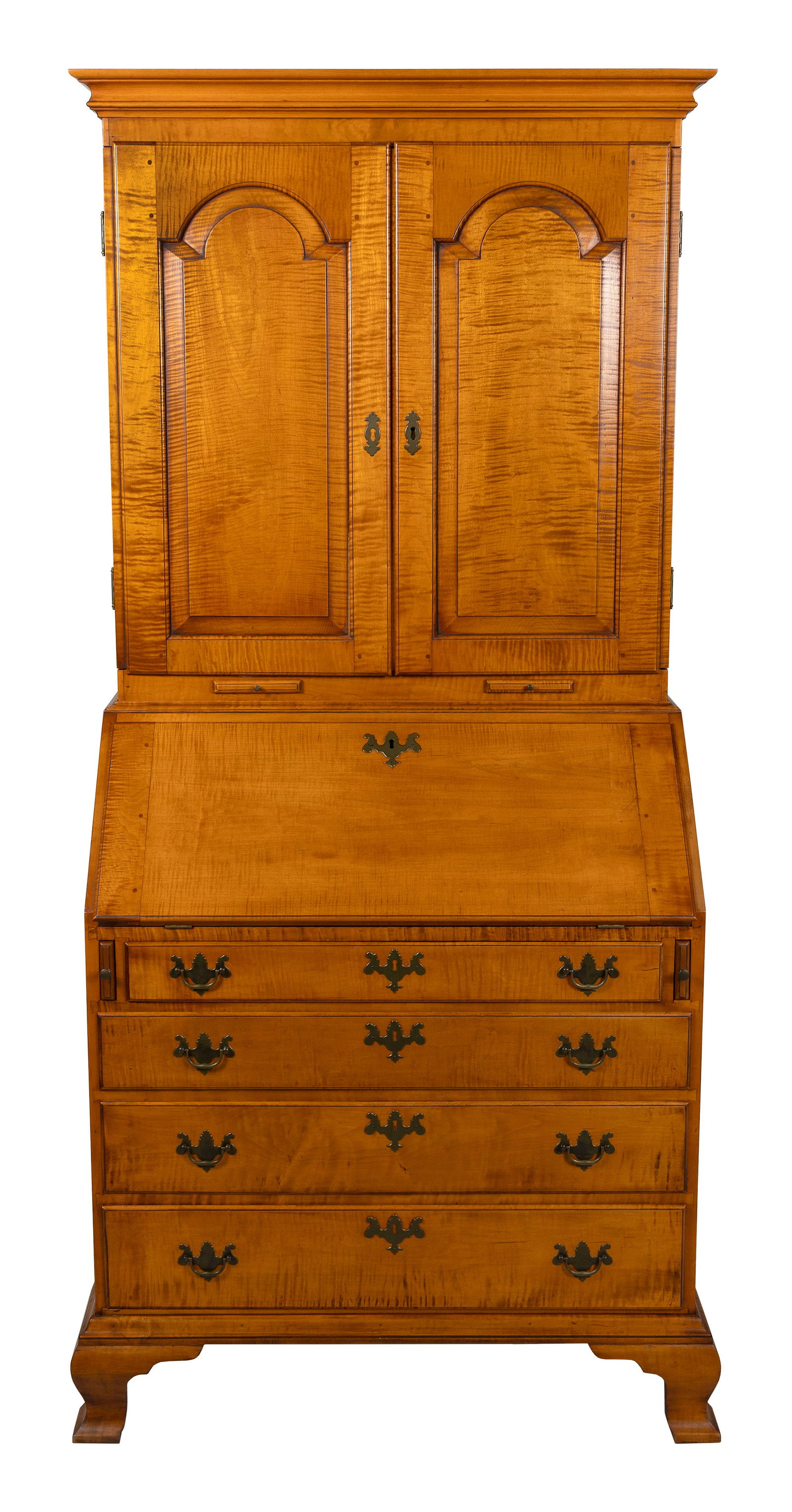 ELDRED WHEELER TIGER MAPLE SECRETARY Massachusetts, 20th Century Height 79". Width 39". Depth 19".: ELDRED WHEELER TIGER MAPLE SECRETARYMassachusetts, 20th CenturyUpper case with two paneled doors enclosing interior shelves. Lower case with a slant lid, fitted interior, four graduated full-width dra