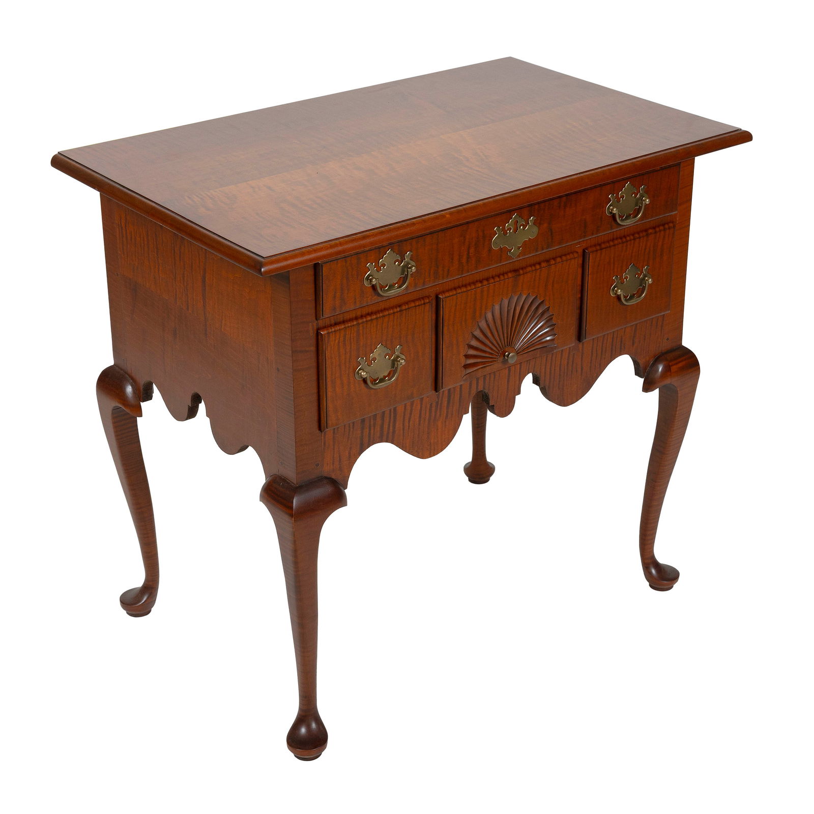 ELDRED WHEELER TIGER MAPLE LOWBOY Massachusetts, 20th Century Height 31". Width 34". Depth 21".: ELDRED WHEELER TIGER MAPLE LOWBOYMassachusetts, 20th CenturyFull-width drawer over three side-by-side drawers, the central with fan carving. Cabriole legs end in pad feet.Height 31". Width 34". Depth