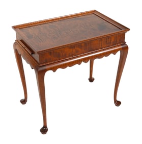 ELDRED WHEELER TIGER MAPLE "NANTUCKET" TEA TABLE Massachusetts, 20th Century Height 27". Length 28".