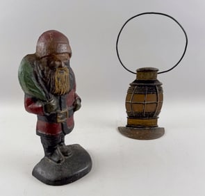 TWO RARE CAST IRON DOORSTOPS Early 20th Century Heights 13" and 13.5".