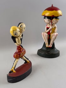 TWO CAST IRON BATHING BEAUTIES DOORSTOPS Early 20th Century Heights 9" and 11".