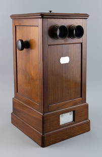 EYE EXAMINATION MACHINE Paris, Circa 1860 Height 18". Width 9.5". Depth 10.75".: EYE EXAMINATION MACHINEParis, Circa 1860Mahogany box with hinged top, eye cups, adjustment knobs and an unmarked inset ivory plaque. Inset maker's card marked "B. Leja Opticien de la Majest? Le Roi de