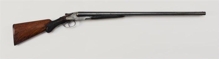 BELGIAN DAMASCUS BARREL SHOTGUN Late 19th Century Length of barrel 28". Total length 43.25".