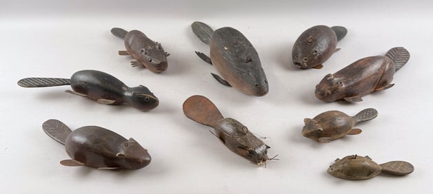 NINE CARVED WOODEN BEAVERS Late 20th Century Lengths from 5" to 15".