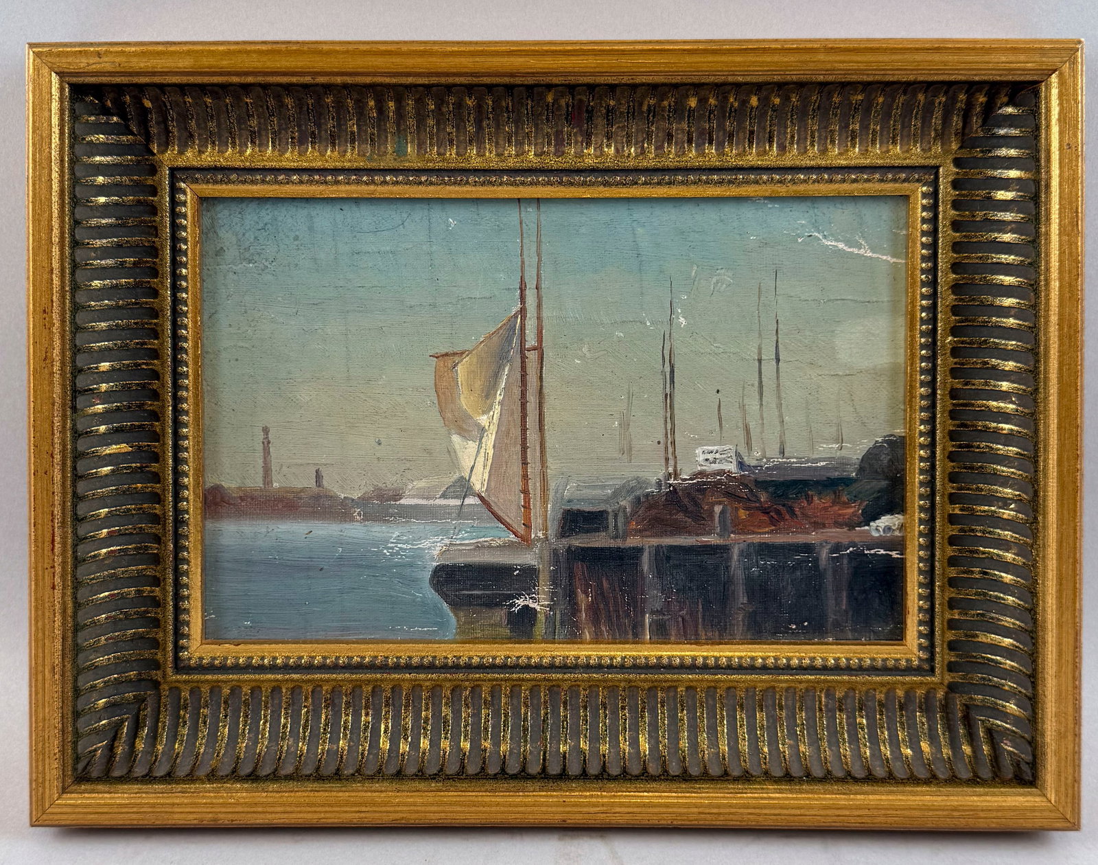 AMERICAN SCHOOL (Early 20th Century,), Boats at a pier., Oil on canvas laid down on board, 5.5" x: AMERICAN SCHOOL Early 20th Century Boats at a pier. Unsigned. Oil on canvas laid down on board, 5.5" x 8.25" sight. Framed 8.5" x 12".