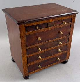 MINIATURE MAHOGANY VENEER CHEST 19th Century Height 8.5". Width 8". Depth 5".
