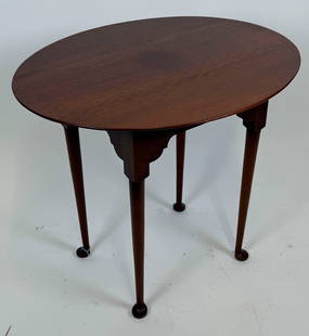 ELDRED WHEELER CHERRY TEA TABLE Massachusetts, 20th Century Height 27.5". Top 36" x 26.5".: ELDRED WHEELER CHERRY TEA TABLEMassachusetts, 20th CenturyOval top. Labeled.Height 27.5". Top 36" x 26.5".