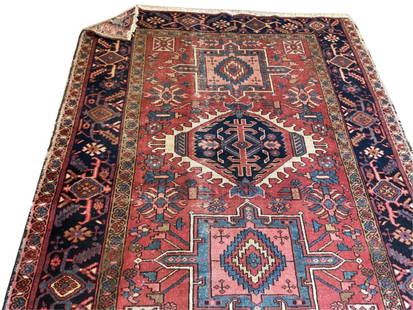 PERSIAN KARAJA RUG: 4'11" X 5'10" Early 20th Century: PERSIAN KARAJA RUG: 4'11" X 5'10"Early 20th CenturyTraditional geometric medallions contain and are surrounded by a variety of red, pink, blue, ivory and faded gold stylized elements. Gold and pink gu
