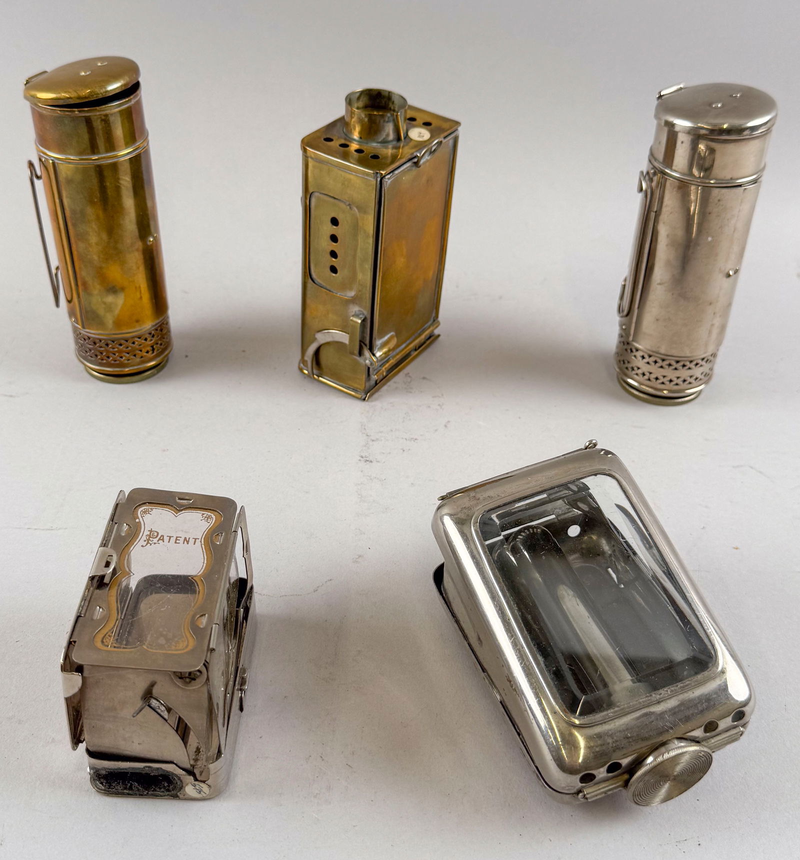 FIVE BRASS AND NICKEL FOLDING LANTERNS Mid-19th to Early 20th Century Lengths to 6". (1 of 2)