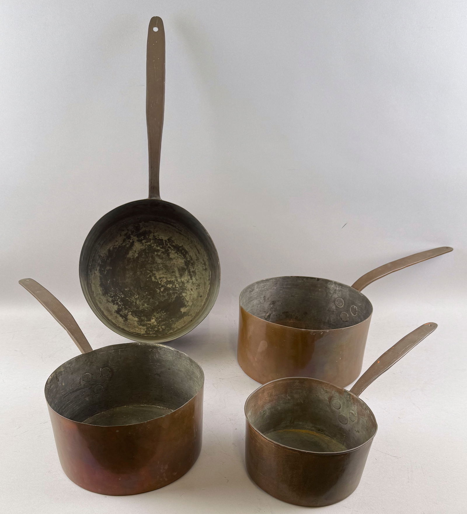 SET OF FOUR FRENCH COPPER POTS 19th Century Diameters from 7" to 11". (1 of 3)