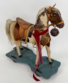 CHILD'S RIDE-ON HORSE Late 19th Century Height 30". Length 28". Width 12".
