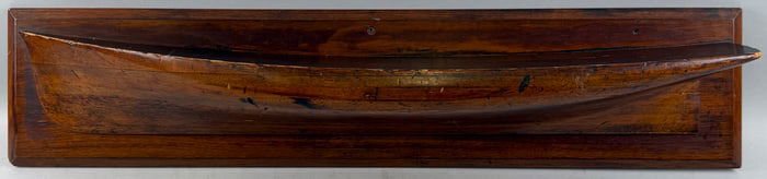MOUNTED HALF HULL MODEL America, 20th Century Backboard 8" x 36".