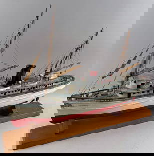 MODEL OF THE STEAMSHIP "CATHERINE" Early 20th Century Length 24".: MODEL OF THE STEAMSHIP "CATHERINE"Early 20th CenturyPainted white, red and blue. Displayed on a wooden cradle.Length 24".