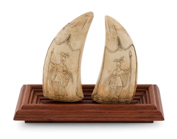 PAIR OF RELIEF-CARVED WHALE'S TEETH DEPICTING BRITANNIA 19th Century Lengths 5.5". On a wooden
