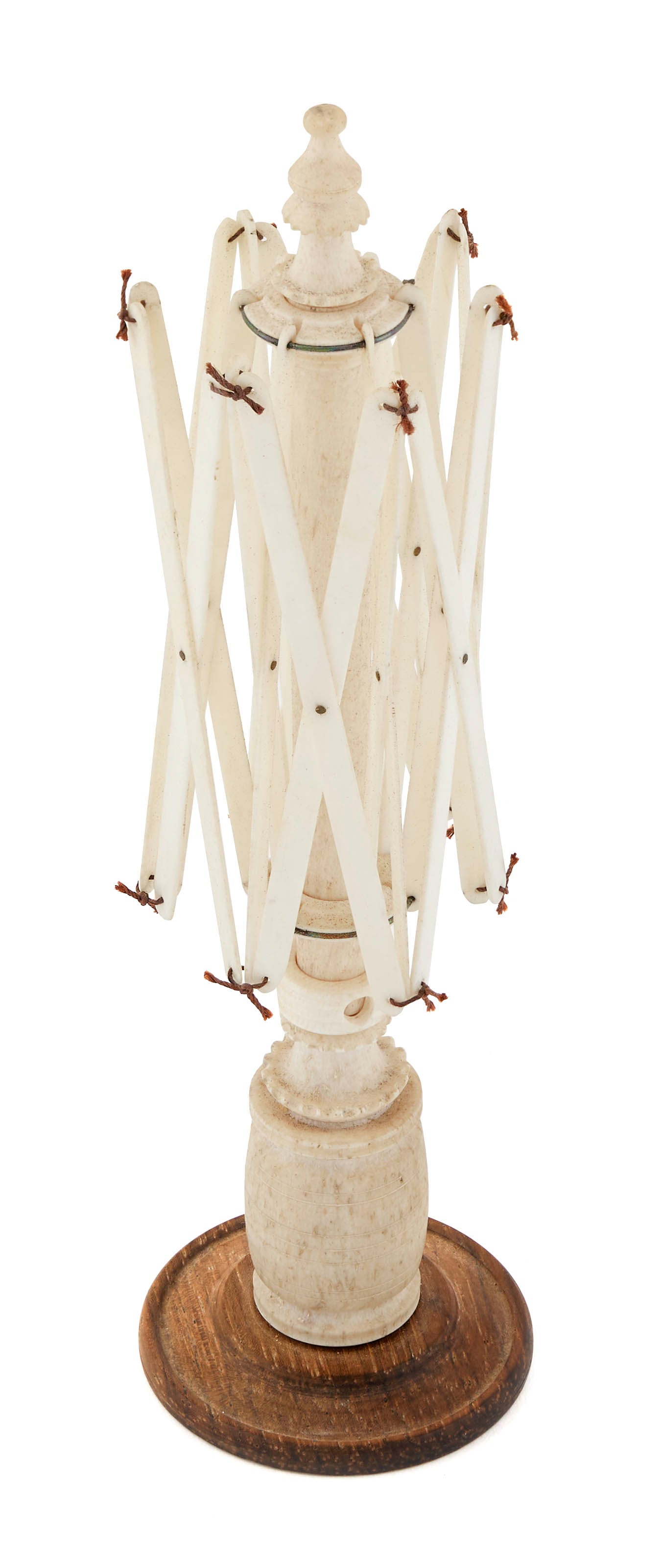 MINIATURE SWIFT 19th Century Height 8.25".: MINIATURE SWIFT 19th Century Set atop a turned wooden foot. Whalebone base carved as a whale oil barrel. Shaft topped with a carved and turned finial. Cage and adjustment collar probably ivory. Height