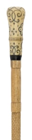 CANE WITH PIQUE HANDLE AND WHALEBONE SHAFT Length 34.75".