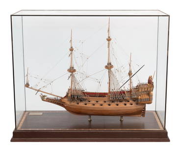 CASED MODEL OF THE "LA COURONNE" 20th Century Case height 29.75". Length 37.5". Width 16.5".: CASED MODEL OF THE "LA COURONNE"20th CenturyBeautifully detailed. Displayed on brass pedestals within a fine glass and wood case.Case height 29.75". Length 37.5". Width 16.5".