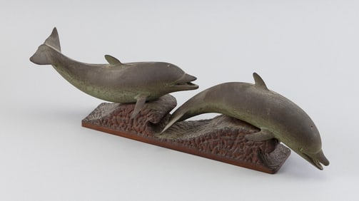 ROBERT INNIS (Massachusetts, 1893-1983), Two dolphins on waves., Carved wood, height 4.25". Length