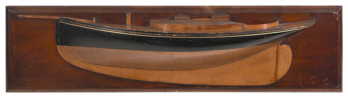 MOUNTED HALF HULL MODEL OF A SAILING YACHT Late 19th/Early 20th Century Backboard 9.75" x 38.5".
